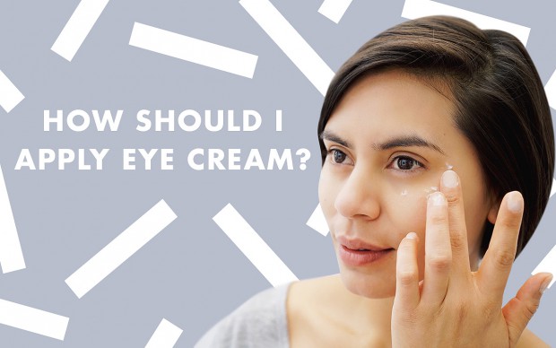 a woman applying eye cream