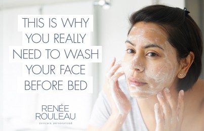a woman washing her face