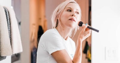 Renee putting on makeup