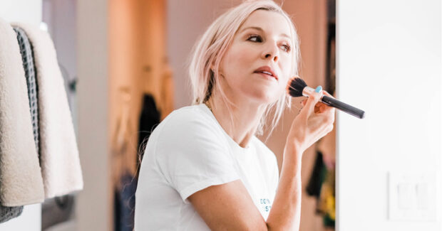 Renee putting on makeup