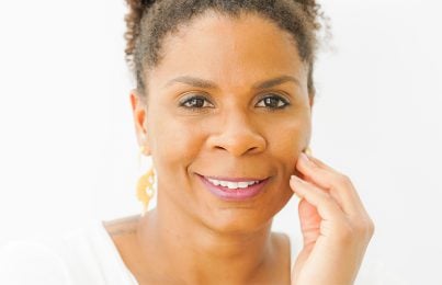 a woman touching her face