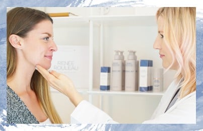Renee Rouleau inspecting a girls face