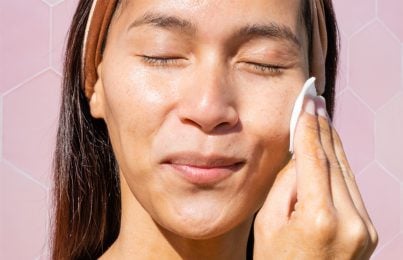 a woman applying Renee Rouleau toner on her face
