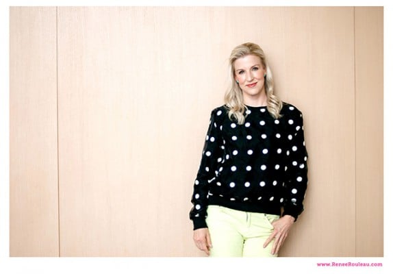 Renee rouleau leaning on a wall