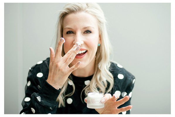 Renee rouleau applying cream on her nose
