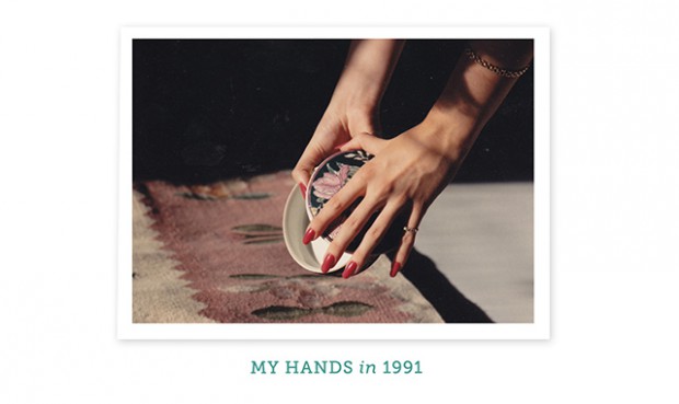 a woman's hands holding some plates