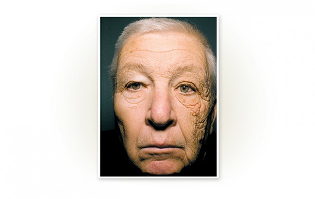 an old mans face with wrinkles