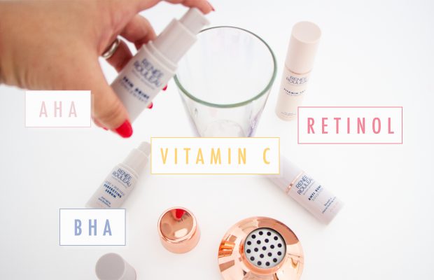 Hand mixing skincare ingredients into a glass