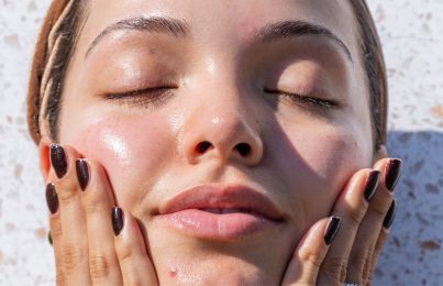 a woman touching her face