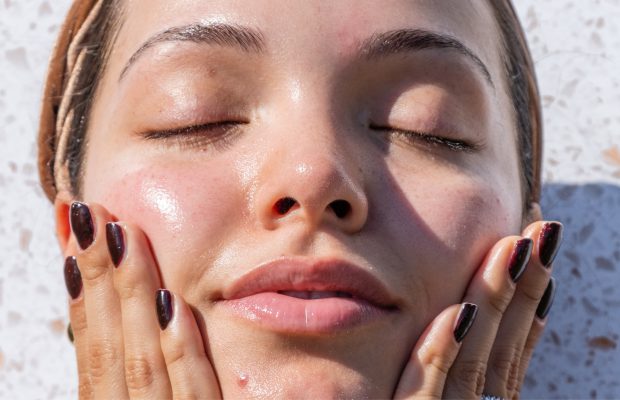 a woman touching her face