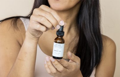 a woman holding Renee rouleaus remedy oil