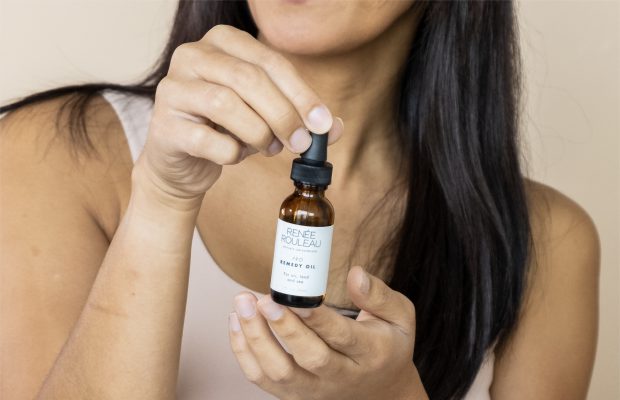 a woman holding Renee rouleaus remedy oil