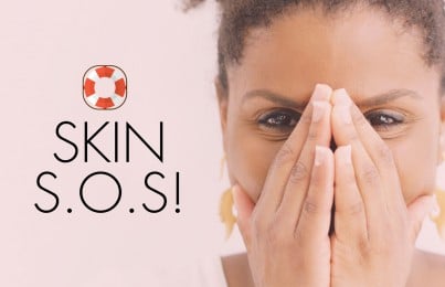 woman covering her face with her hands