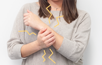 a woman scratching her arm