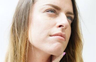 a woman thinking if retinol makes her skin thin
