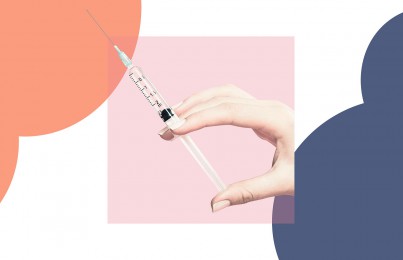 a hand holding a botox injection