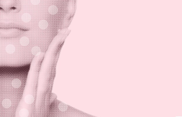 a woman with her hand on her cheek
