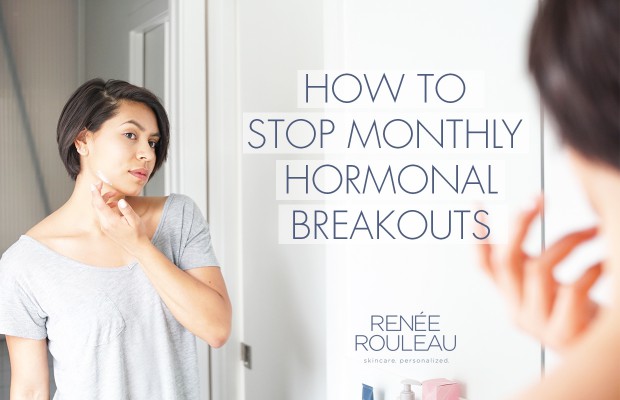 a woman checking her hormonal breakouts