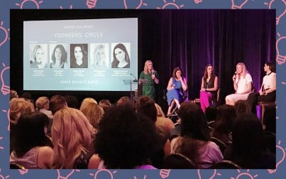 a panel of women on stage
