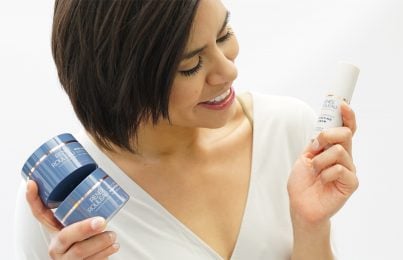 a woman holding Renee Rouleau's exfoliating products