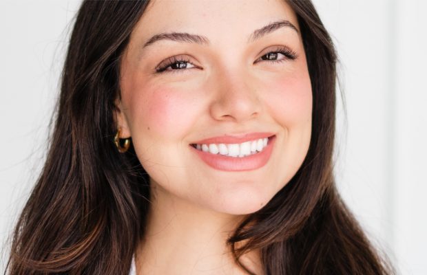 a woman smiling to the camera