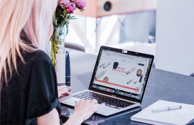 woman looking at her laptop screen