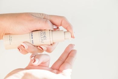 pumping Renee Rouleau's Vitamin C&E cream onto a finger