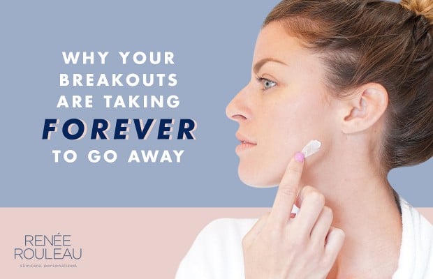 a woman applying a cream on her blemish