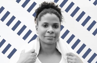 a woman with a towel on her shoulders