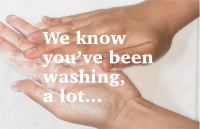 Woman washing hands with foaming soap