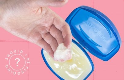 woman scooping Vaseline out of a jar