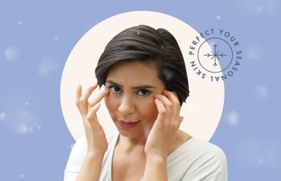 woman applying a skincare product on her face