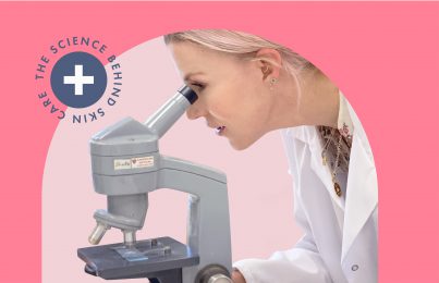 Renee Rouleau using a microscope to inspect a skincare product