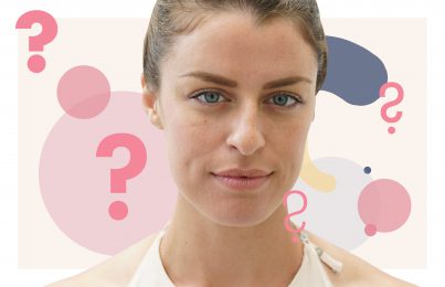 a woman looking into the camera surrounded by question marks