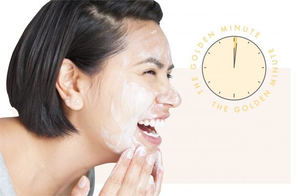 woman washing face with clock showing one minute passing