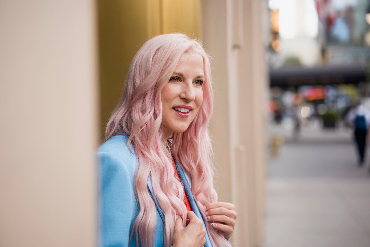 Renee Rouleau standing in a street looking in the distance
