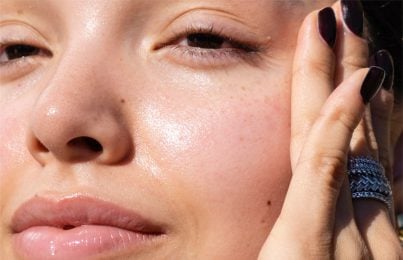 a woman with glowing trendy donut skin