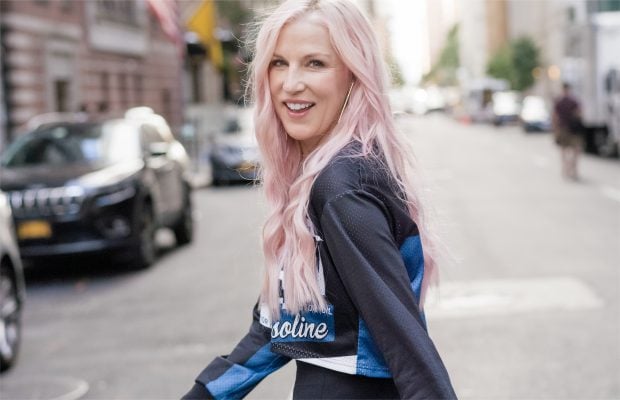 Renée Rouleau crossing the street and looking back