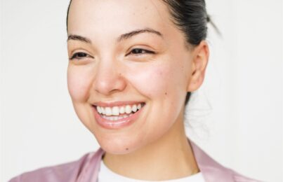 a woman smiling and looking in the distance