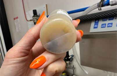 mold can be seen growing inside a skincare product bottle emphasizing the importance of product testing