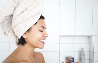 Woman standing in the bathroom after a shower